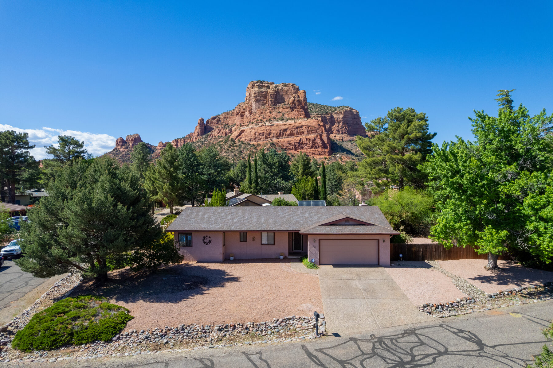 Home framed by Sedona red rock