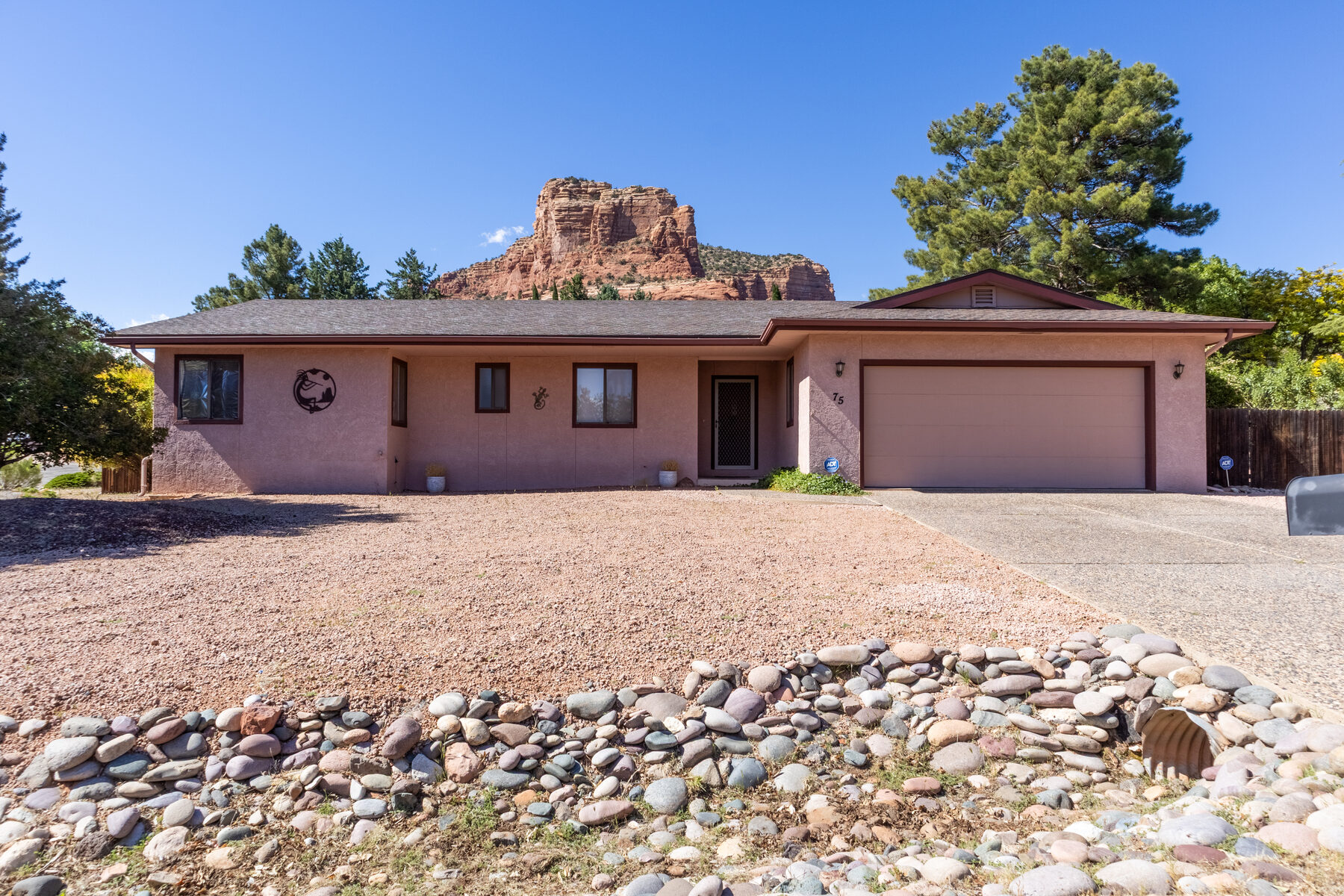Home framed by Sedona red rock